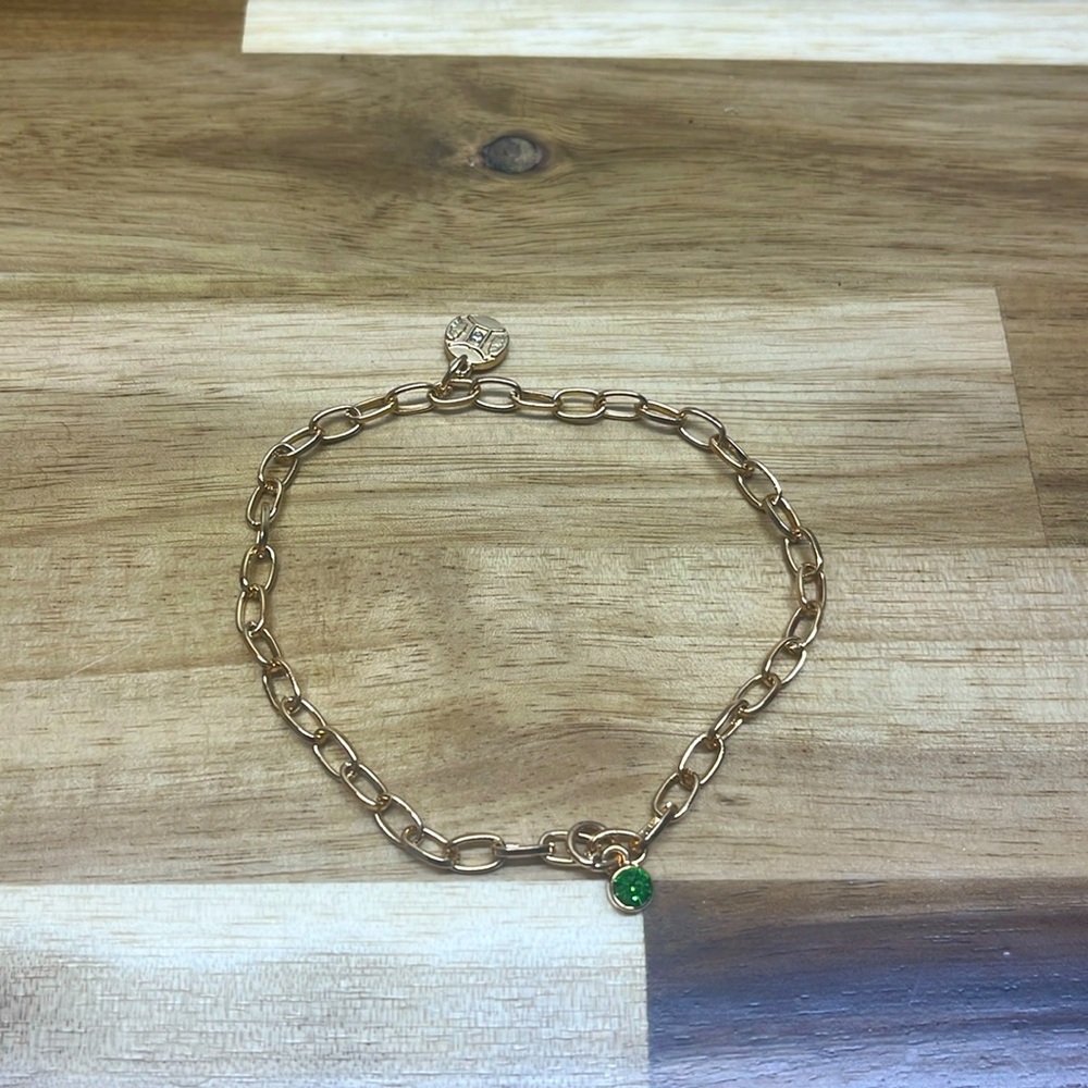 Gemini horoscope charms on gold chain bracelet
